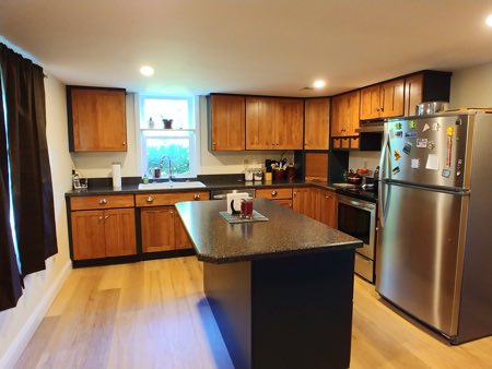 customer kitchen after renovation. granite countertops, new recessed lighting, new cabinets
